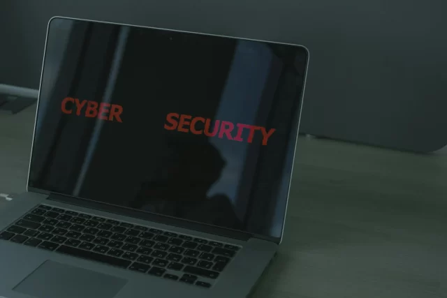 A laptop displaying the text Cyber Security, highlighting the importance of robust data loss protection.