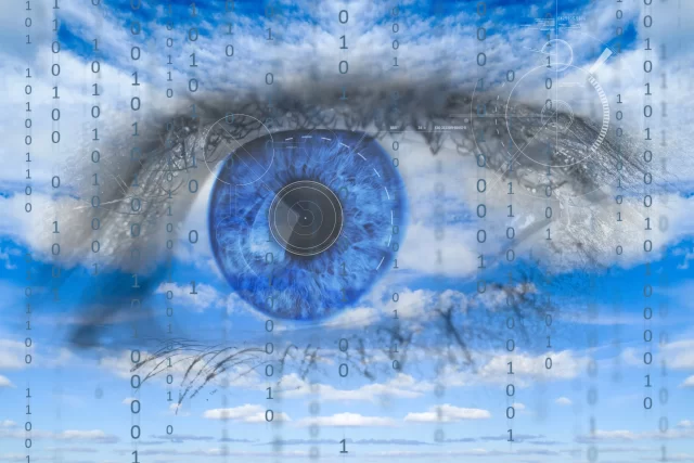 Close-up of a human eye layered with digital binary code and sky, illustrating database activity monitoring in Switzerland.