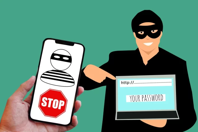 A hacker stealing credentials via a fake website, illustrating the importance of general data protection regulation compliance.